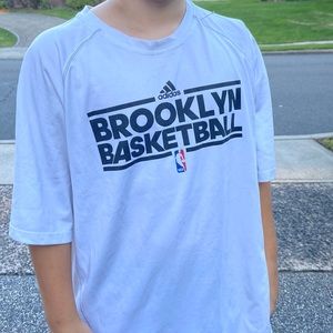 Boys Adidas t-shirt that says “Brooklyn Basketball” with NBA logo